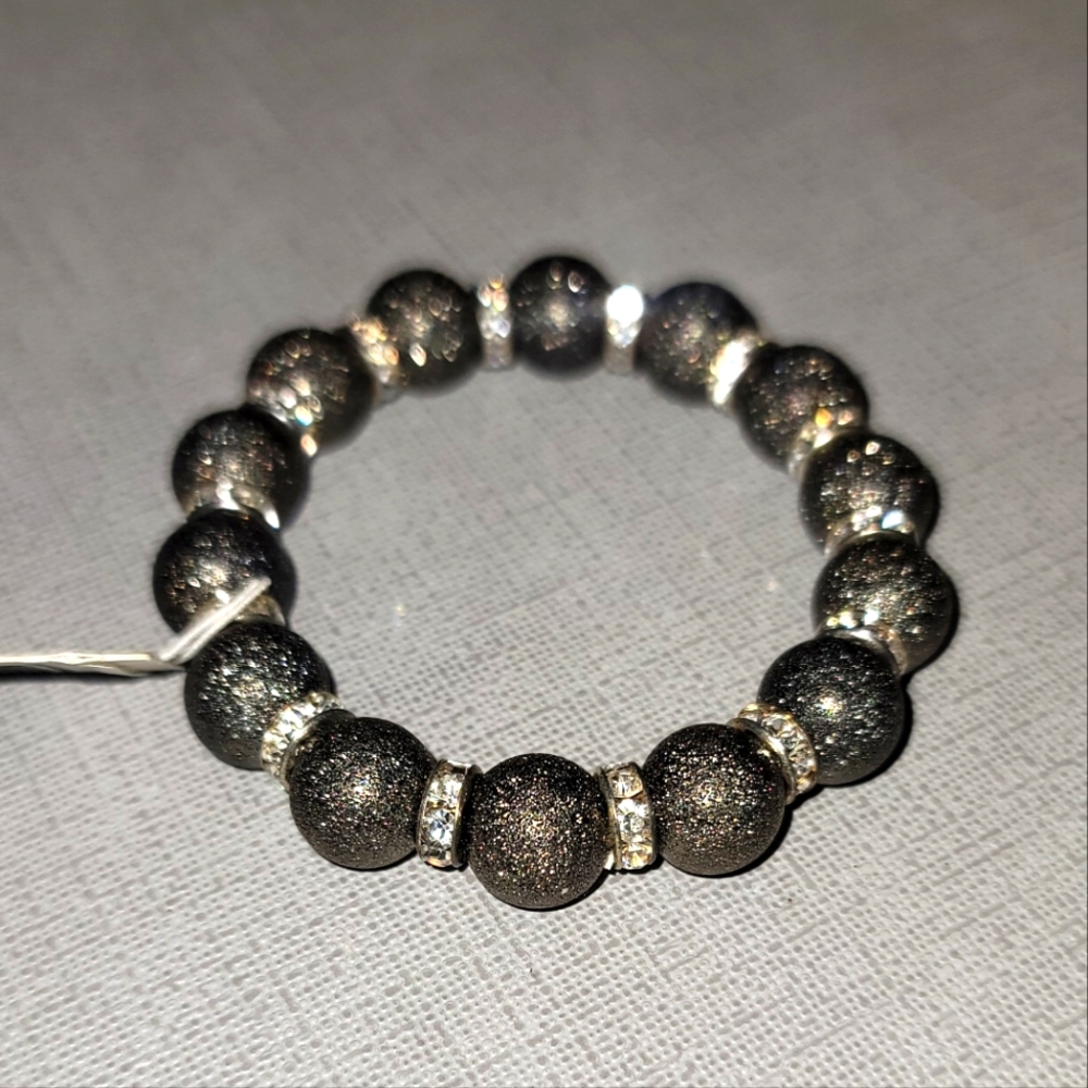 NWT- Shiny dark silver stretch bracelet with clear gems